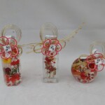 お正月向けにタッセルや水引飾りをワンポイントに赤を基調に仕上げた商品。